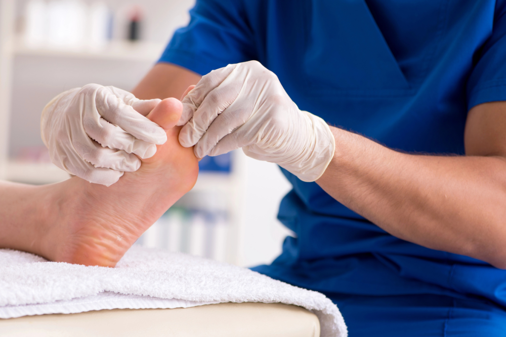 A doctor examining a patient’s toenails for issues caused by repeated trauma to the nails and providing care to prevent complications in Texas.
