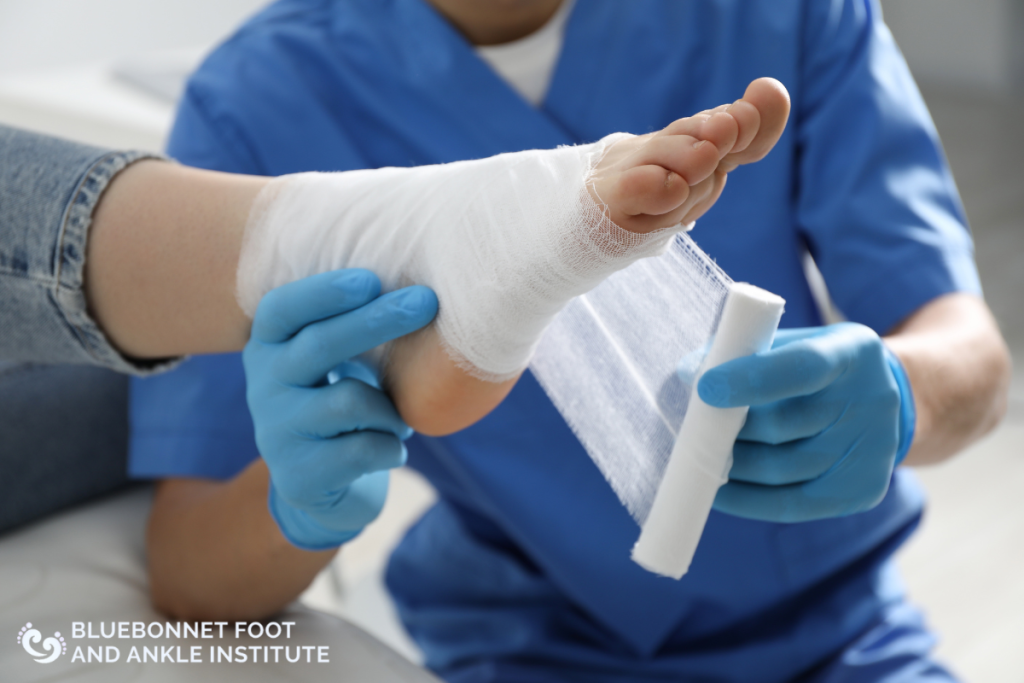A doctor bandaging a patient with Diabetic Charcot Foot after treating her foot in Austin, Texas.
