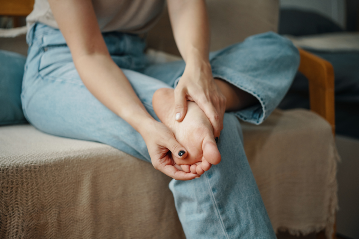 A woman with diabetes examining her foot as part of her daily foot care routine in Austin, Texas.